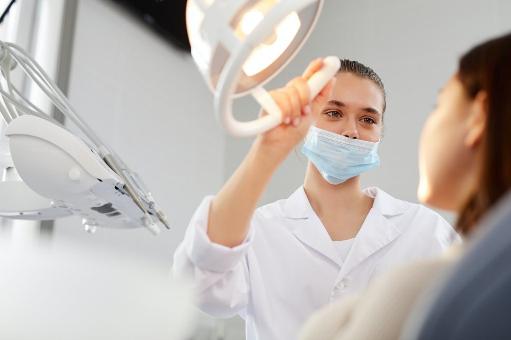 Dental Surgeon Examining Patient | Isa Smiles