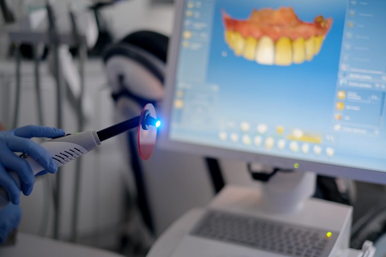 Dentist Performing CEREC Treatment using Computer